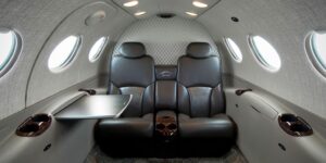 luxury private jet interior with luggage and spacious seating