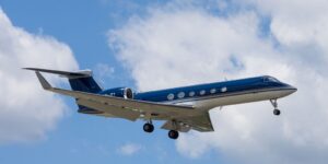 Gulfstream private jet flying over tropical islands