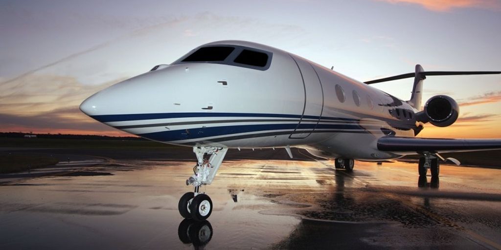 private jet on a runway in Marathon, FL with the Florida Keys in the background